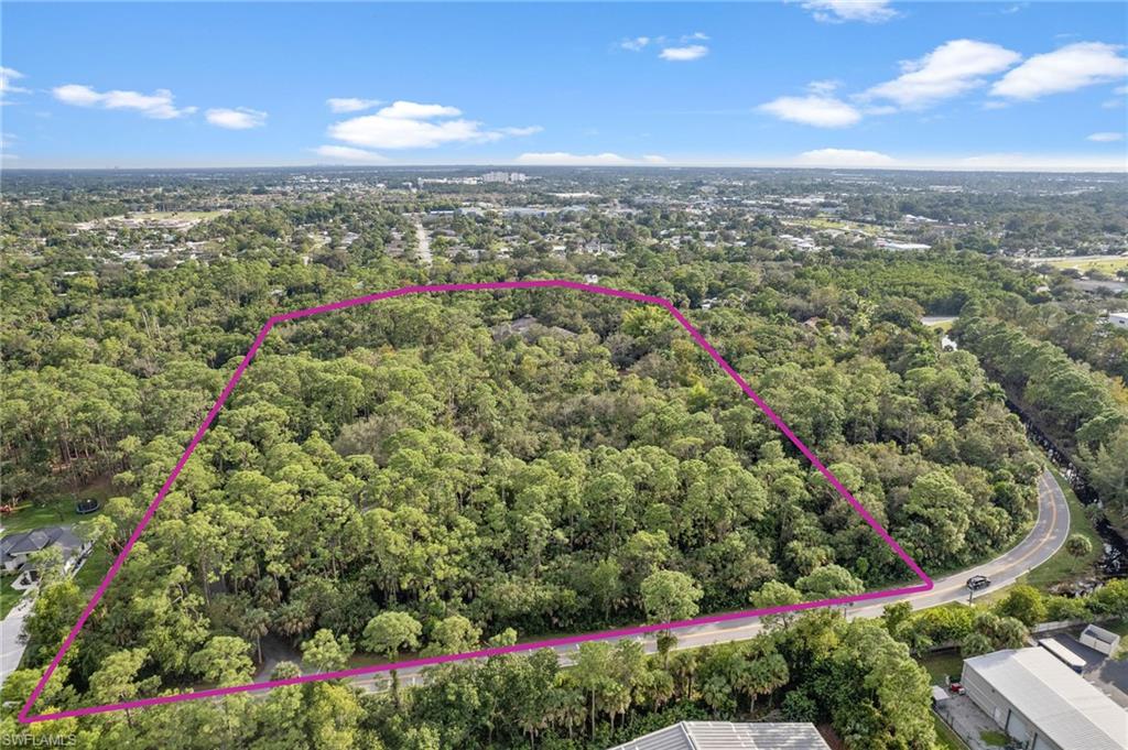 3720 Gail Boulevard Naples, FL 34104 - Photo 1 of 27 a view of a city and mountains