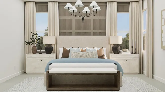 a large white bed sitting in a bathroom next to a window