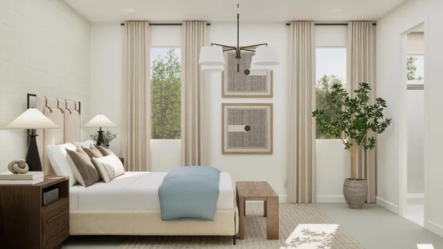 a bedroom with a bed and a potted plant