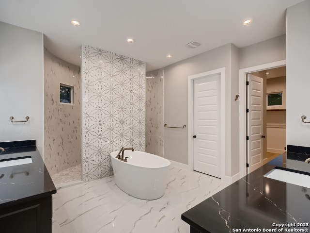 208 River Ridge Boerne, TX 78006 - Photo 18 of 38 a spacious bathroom with a bathtub and shower