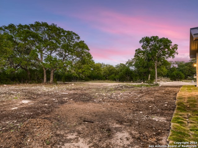 208 River Ridge Boerne, TX 78006 - Photo 28 of 38 a view of a field with trees in the background