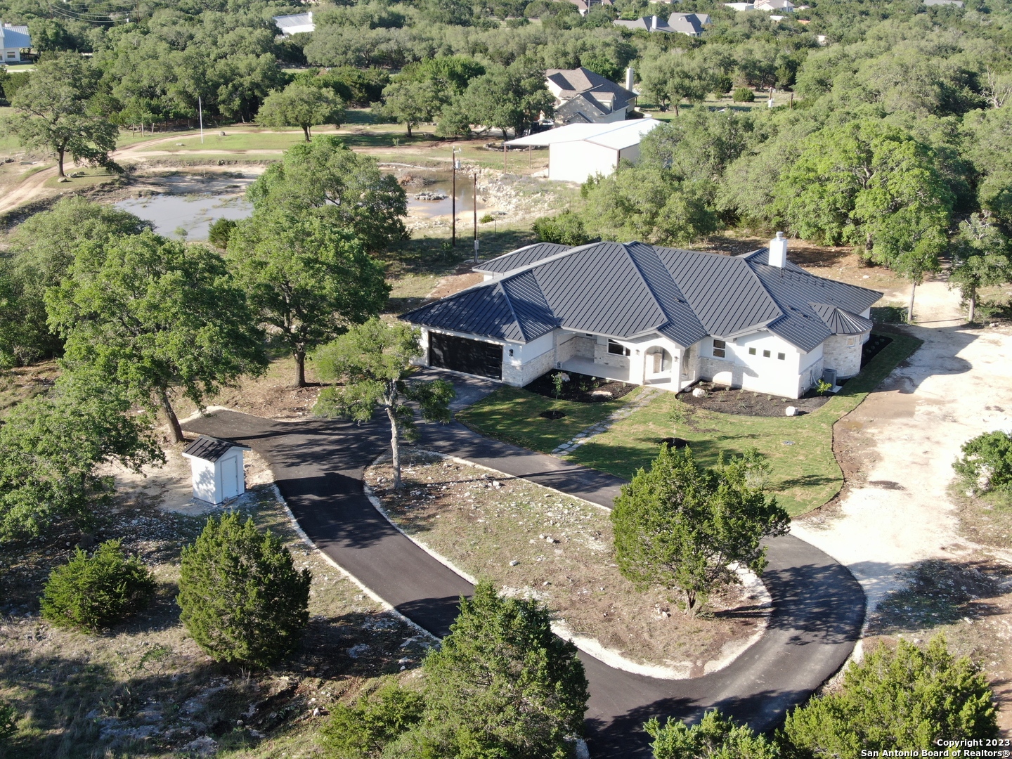 208 River Ridge Boerne, TX 78006 - Photo 35 of 38 an aerial view of a house with garden space and street view