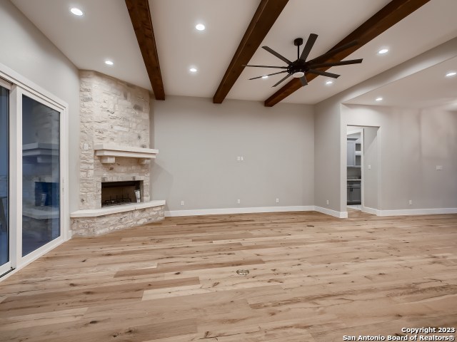 208 River Ridge Boerne, TX 78006 - Photo 6 of 38 a view of an empty room with a fireplace and a window