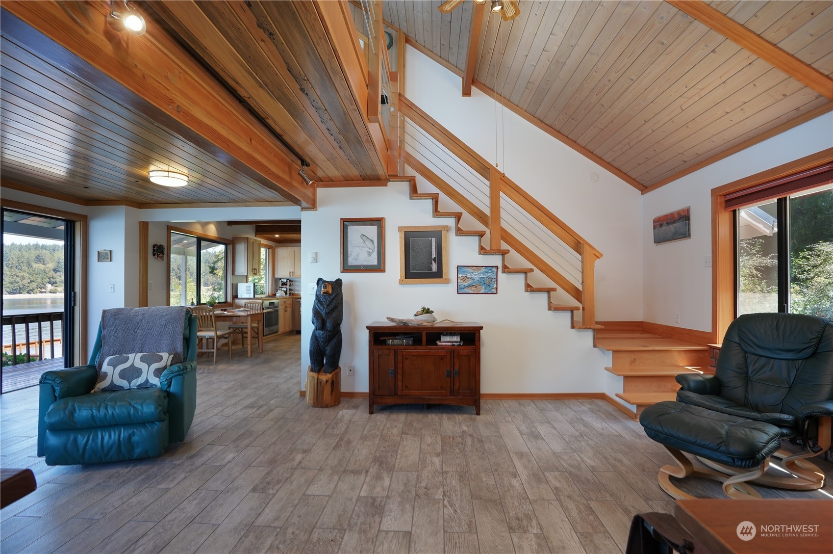 14507 Outer Bay Road Anderson Island, WA 98303 - Photo 18 of 40 a living room with furniture and wooden floor
