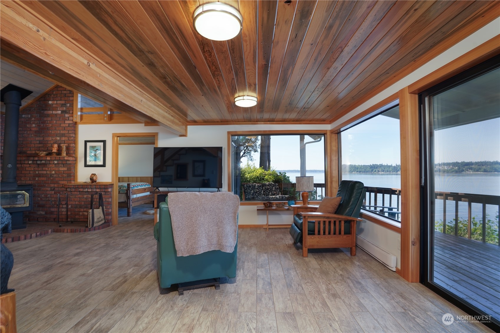 14507 Outer Bay Road Anderson Island, WA 98303 - Photo 24 of 40 a living room with furniture and a flat screen tv