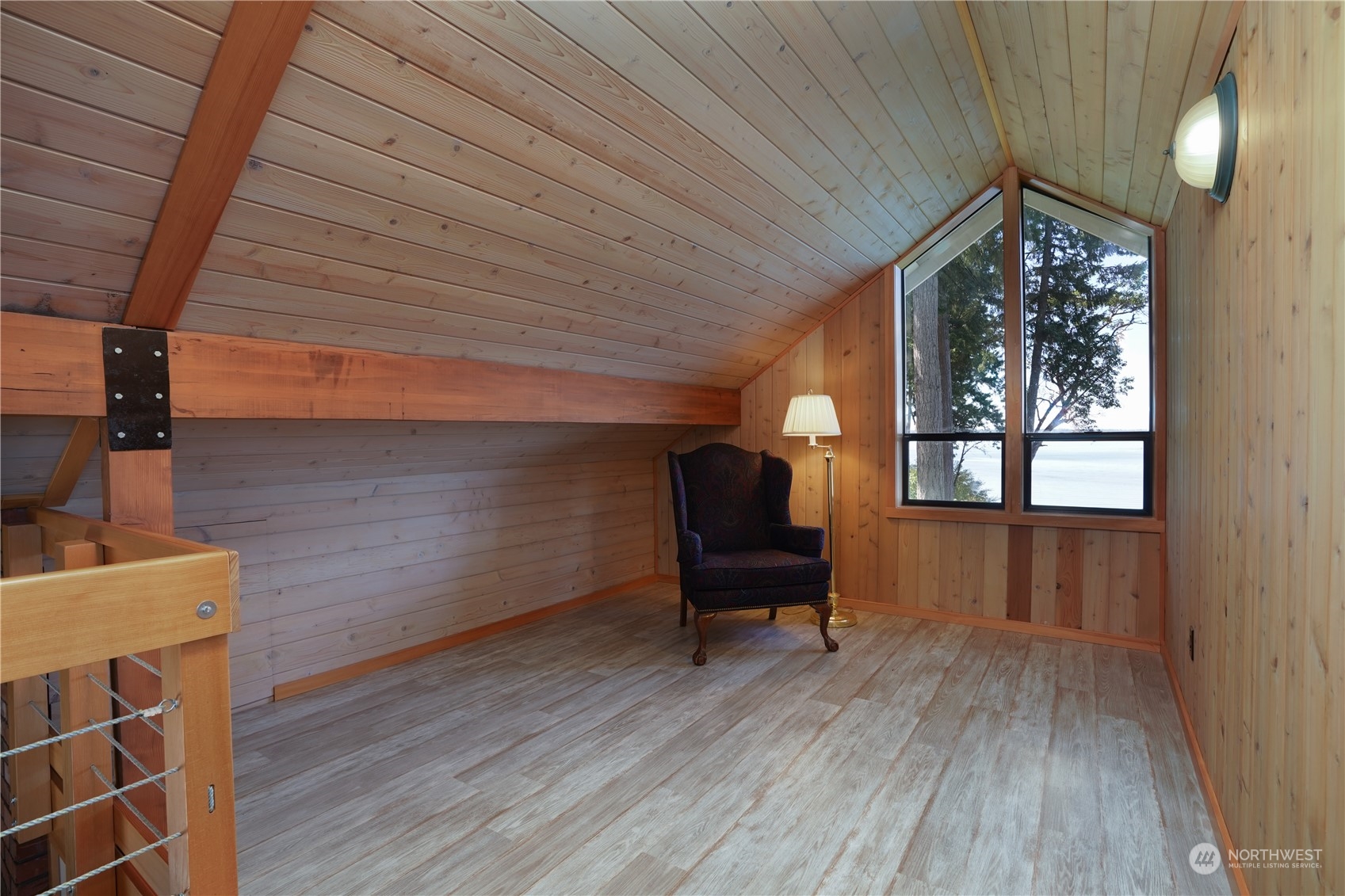 14507 Outer Bay Road Anderson Island, WA 98303 - Photo 27 of 40 a view of livingroom with furniture wooden floor and windows