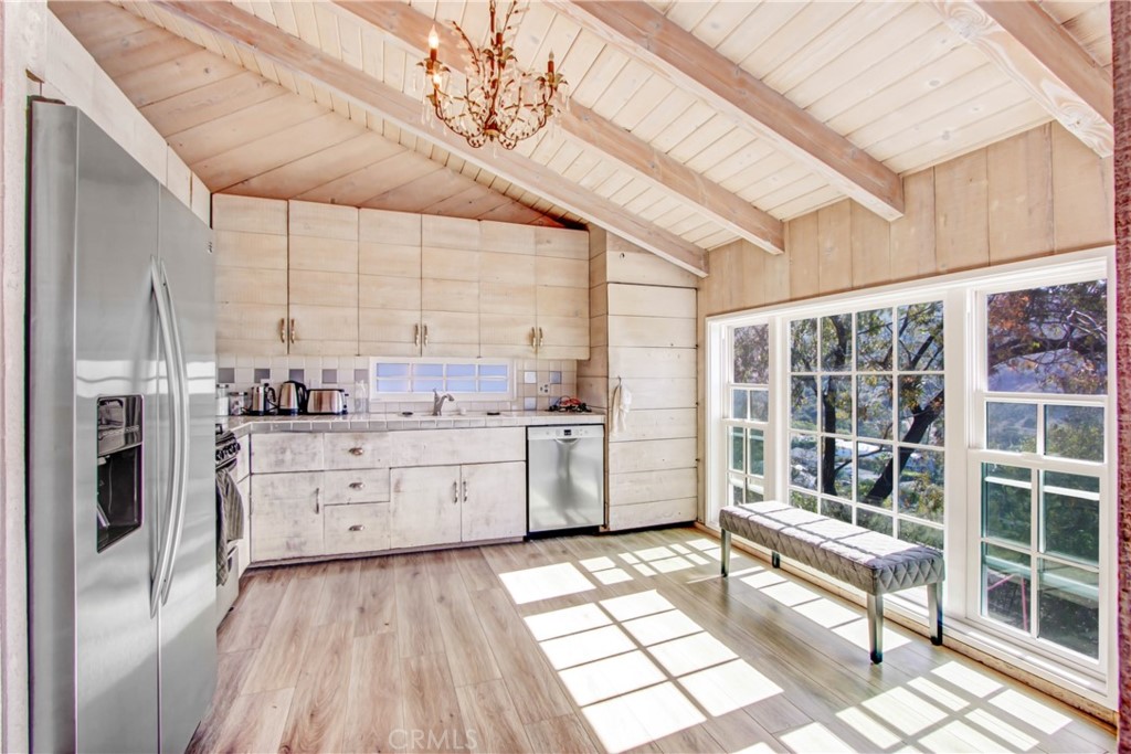 1486 Morningside Circle, Unit MAIN Laguna Beach, CA 92651 - Photo 14 of 24 a room with a bed and a large window