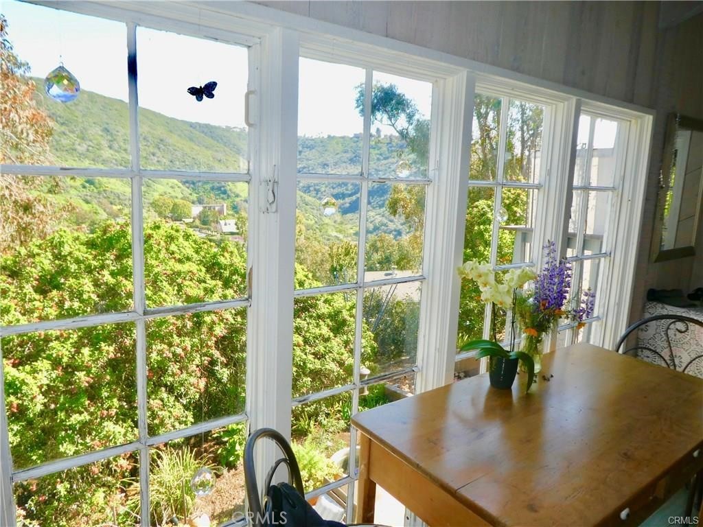 1486 Morningside Circle, Unit MAIN Laguna Beach, CA 92651 - Photo 15 of 24 a view of a dining room with furniture and window
