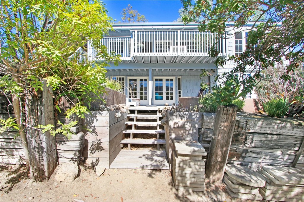 1486 Morningside Circle, Unit MAIN Laguna Beach, CA 92651 - Photo 17 of 24 a front view of a house with a garden