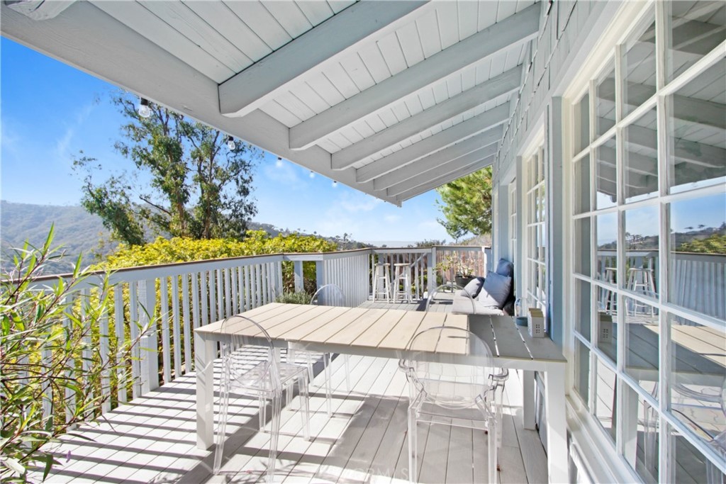 1486 Morningside Circle, Unit MAIN Laguna Beach, CA 92651 - Photo 3 of 24 a balcony with furniture and a potted plant