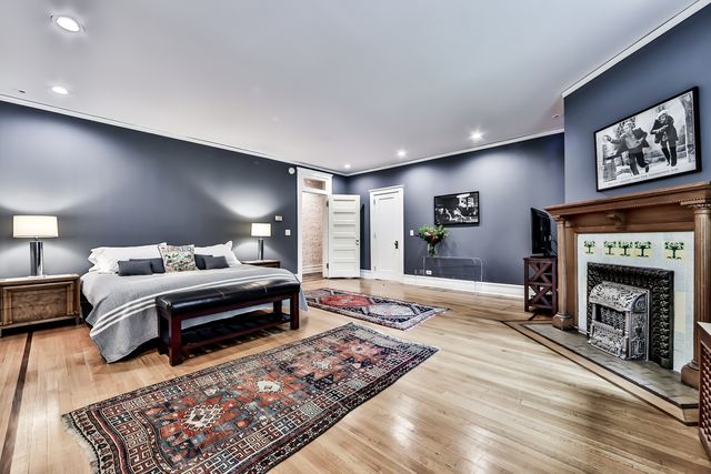 a spacious bathroom with double vanity and a large mirror