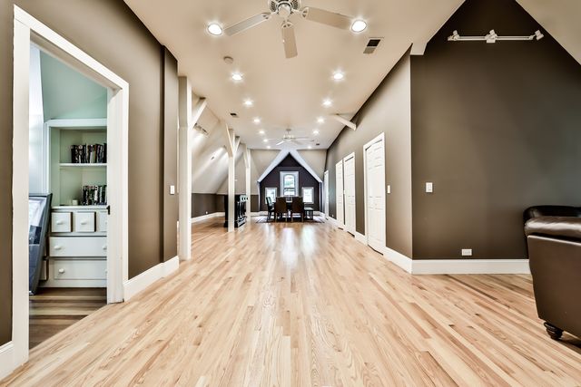 a spacious bedroom with a bed and a large window