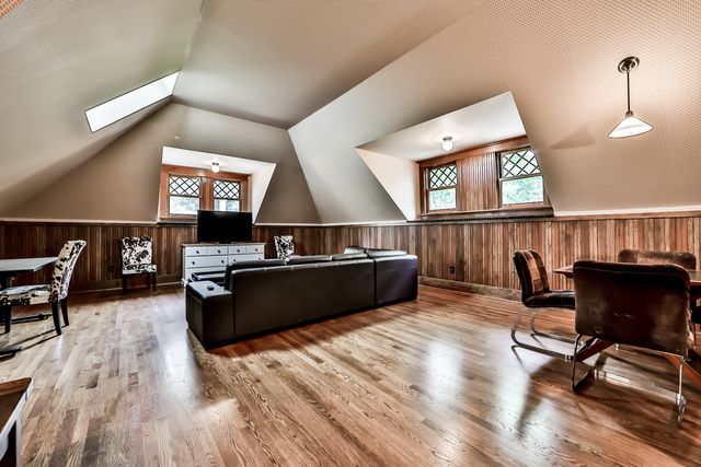 a kitchen with granite countertop a stove a sink and a refrigerator