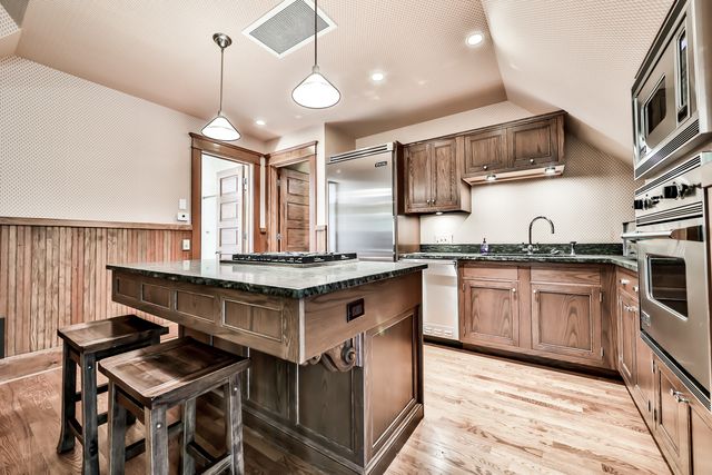 a bed sitting in a bedroom next to a large window