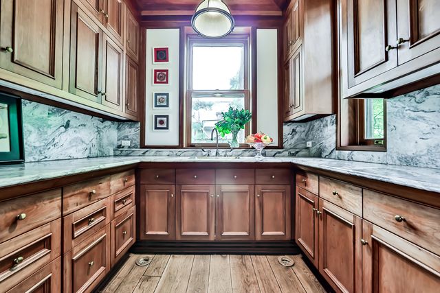 a kitchen with stainless steel appliances granite countertop a sink and cabinets