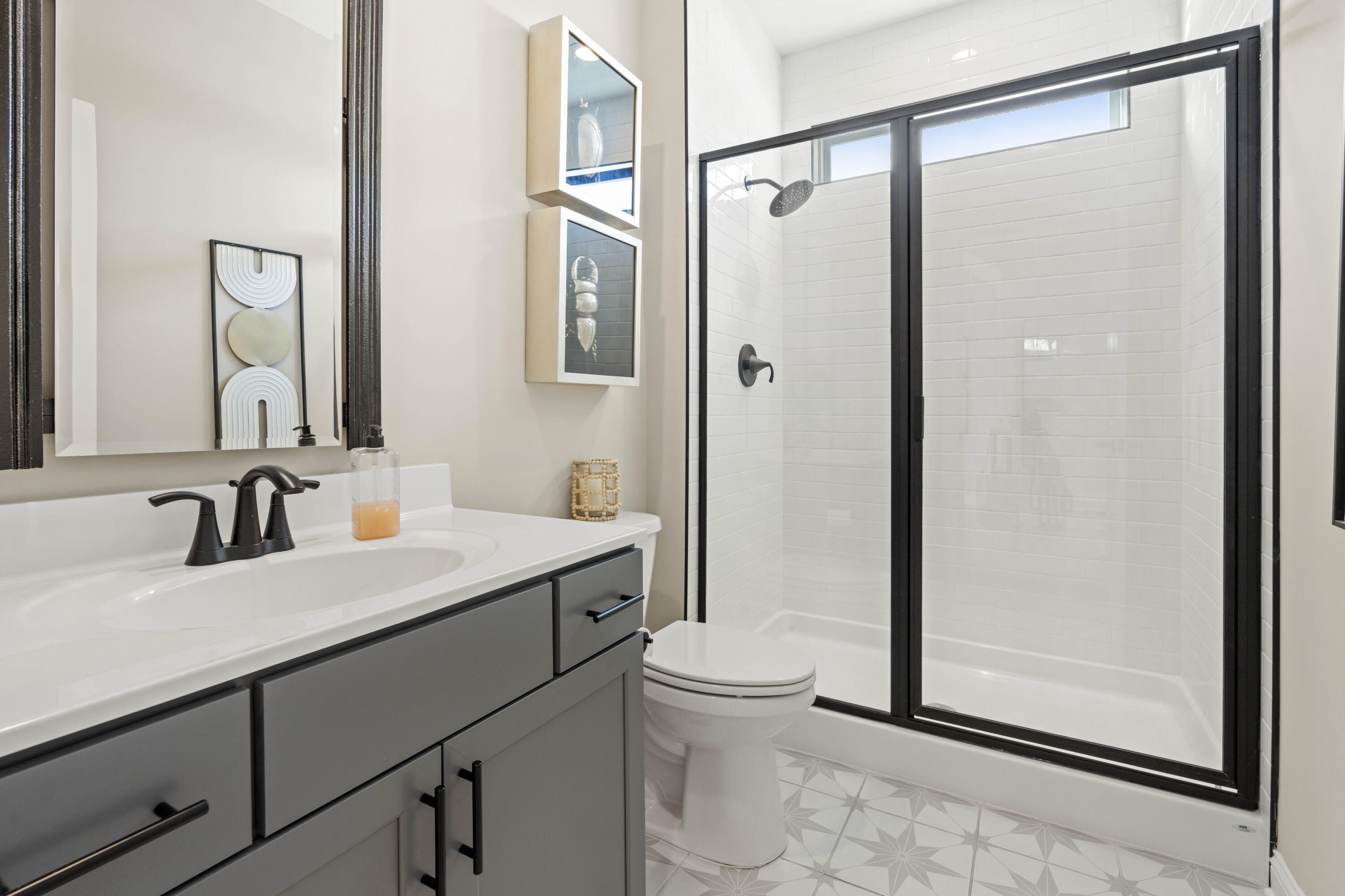 91 Bergamo Lane Crown Point, IN 46307 - Photo 6 of 29 a bathroom with a granite countertop sink toilet and shower
