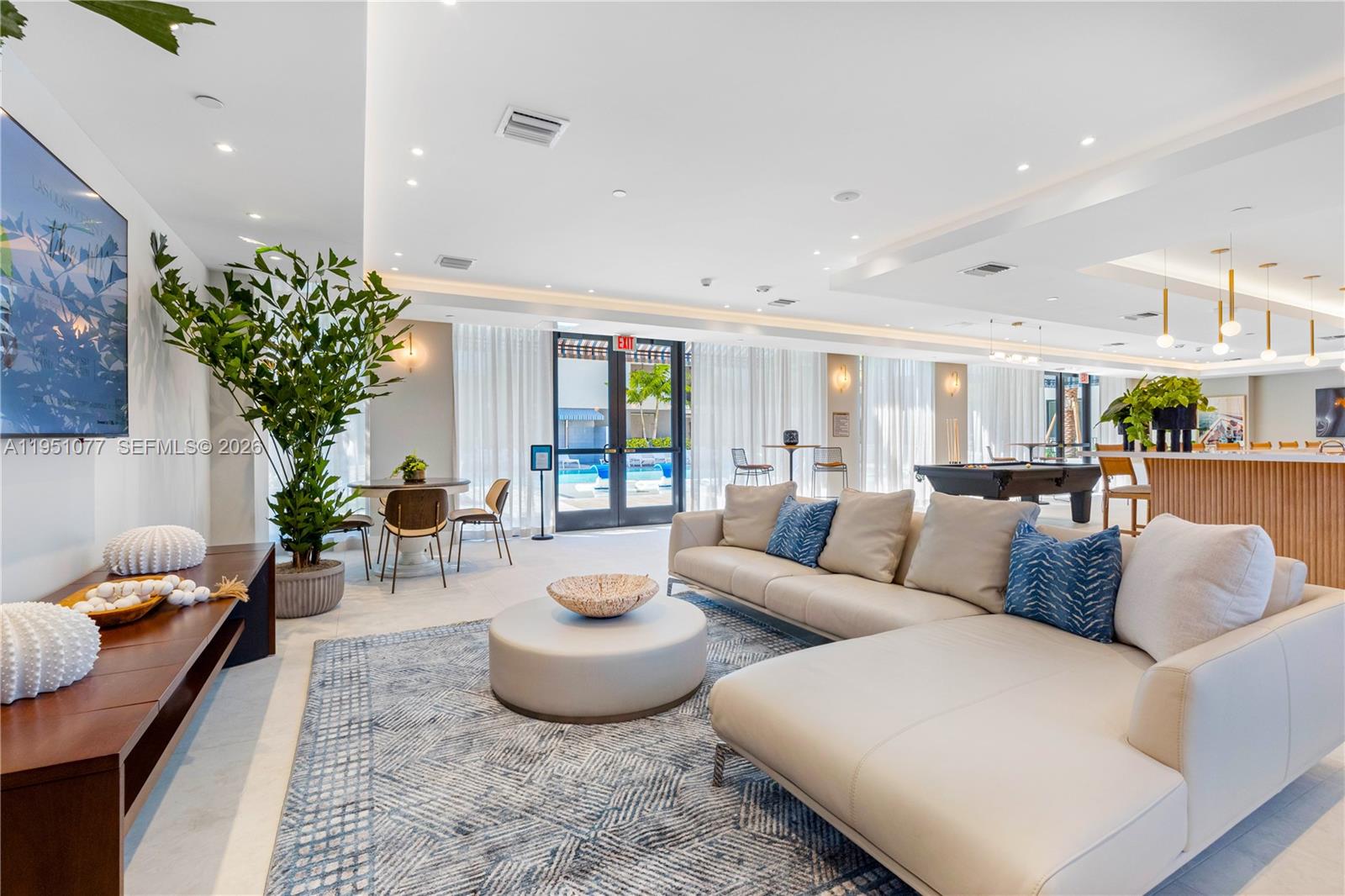 208 North Federal Highway, Unit 361 Pompano Beach, FL 33062 - Photo 12 of 25 a living room with furniture potted plant and a window