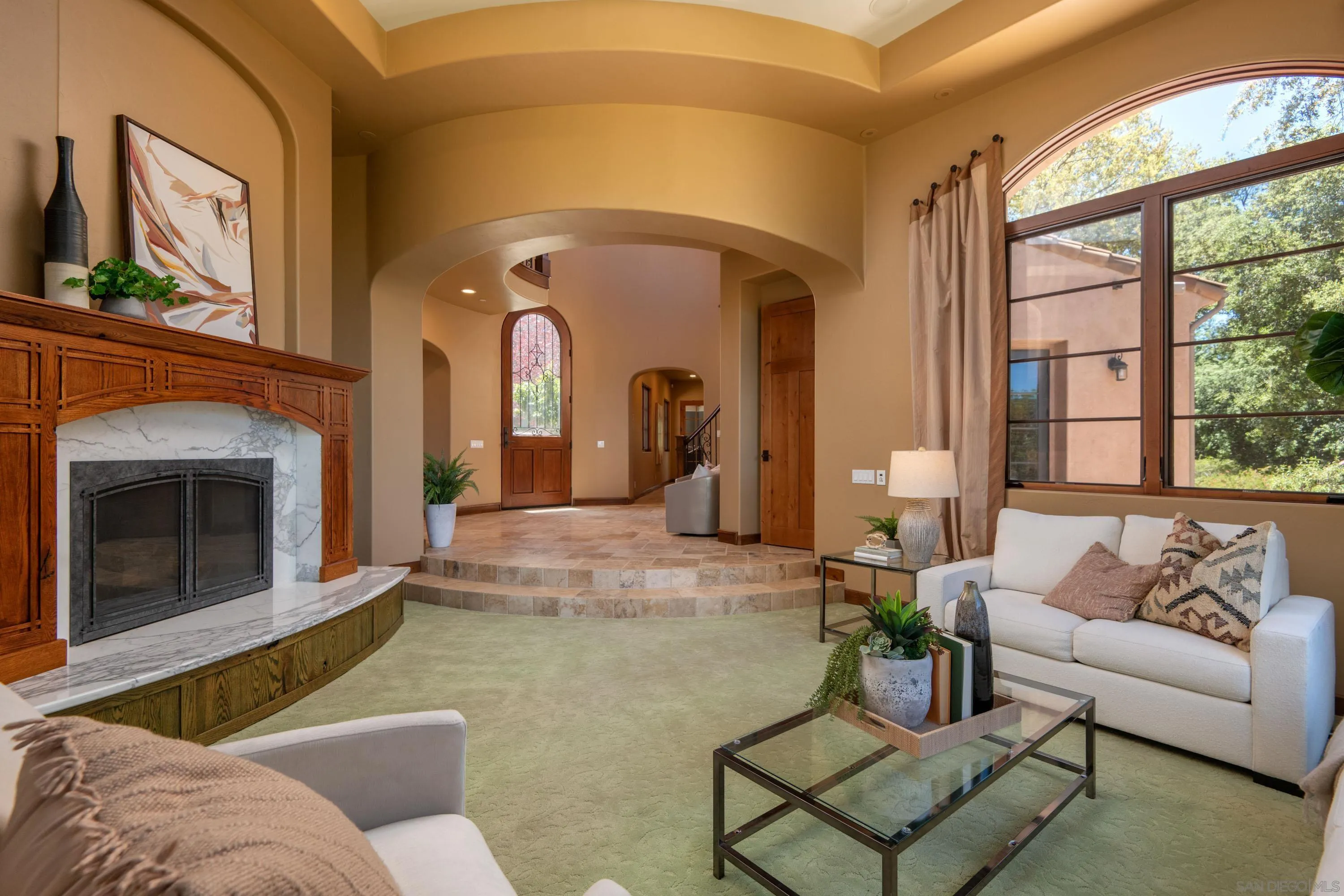 23835 Viejas Grade Road Descanso, CA 91916 - Photo 12 of 62 a living room with furniture a fireplace and a large window