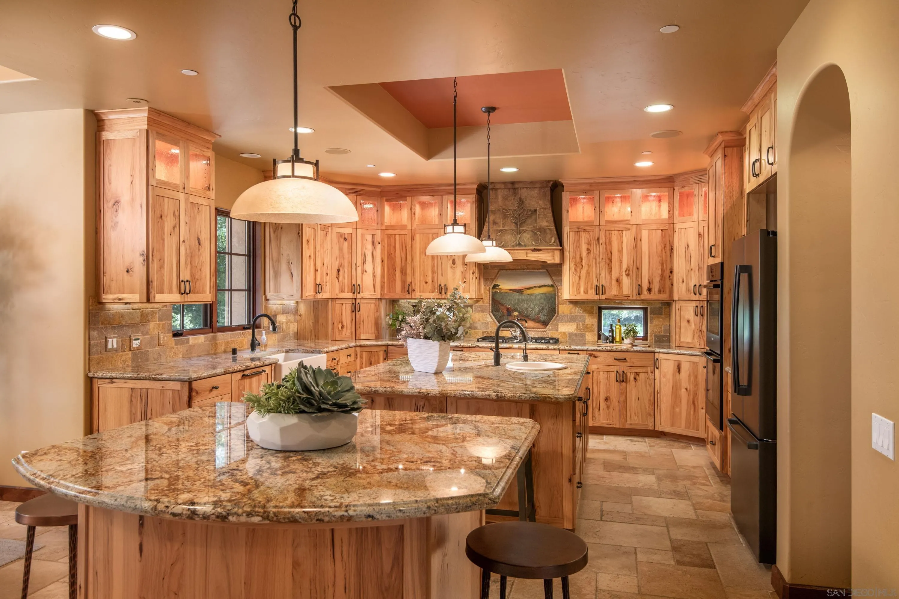 23835 Viejas Grade Road Descanso, CA 91916 - Photo 19 of 62 a kitchen with kitchen island granite countertop a large counter top and living room