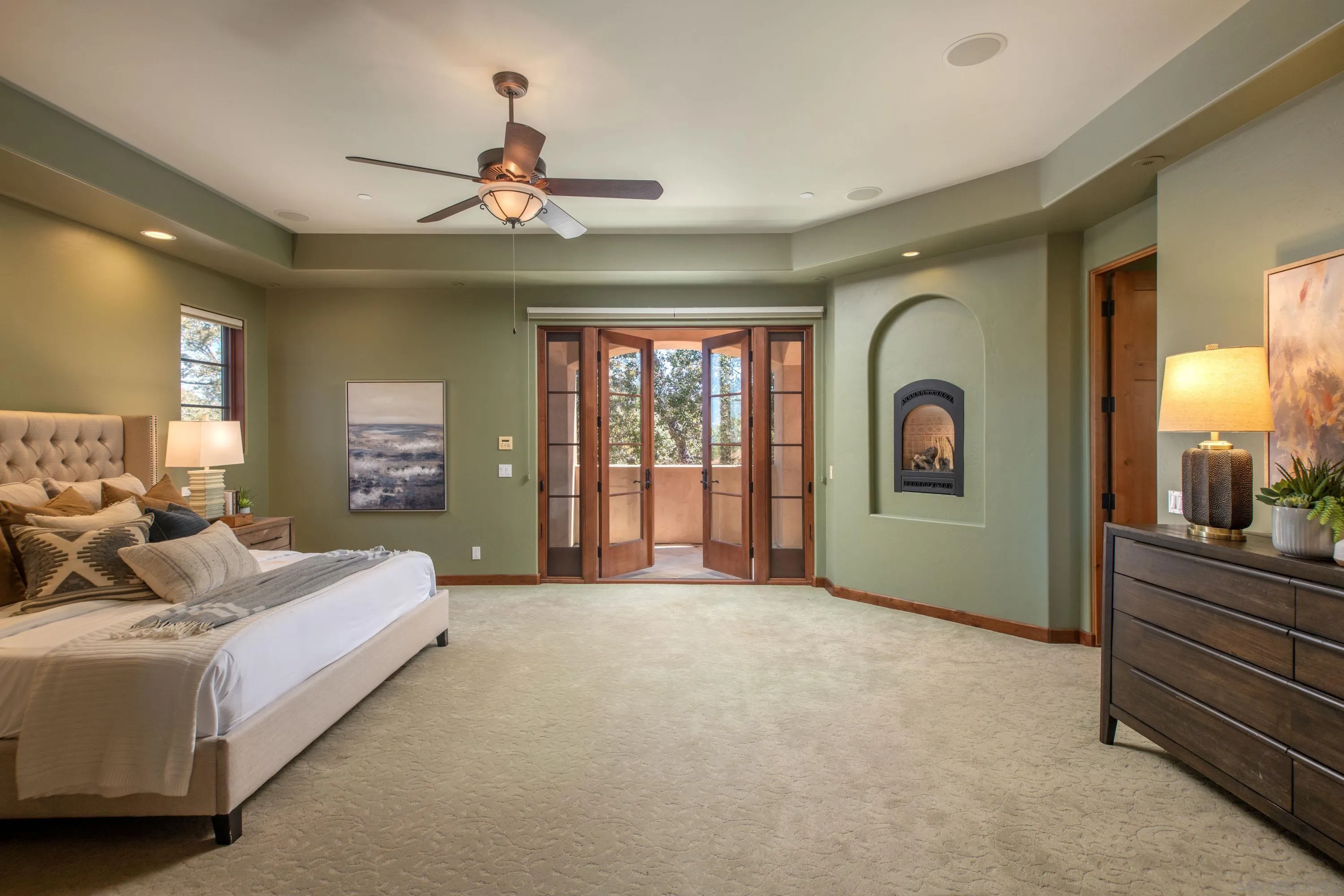 23835 Viejas Grade Road Descanso, CA 91916 - Photo 30 of 62 a spacious bedroom with a large bed and a chandelier