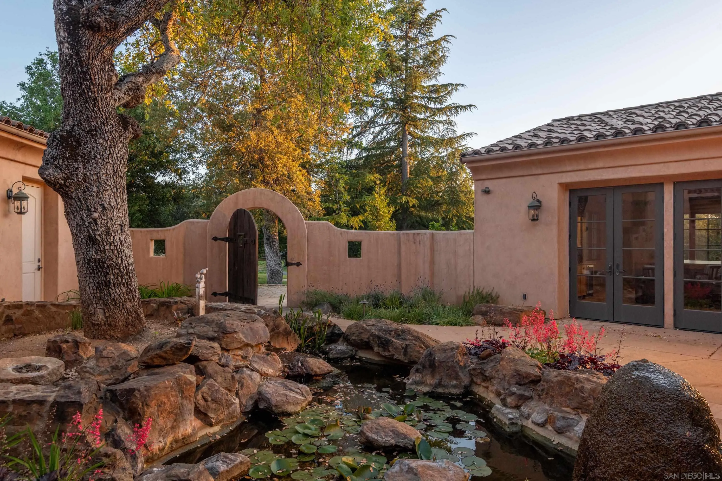 23835 Viejas Grade Road Descanso, CA 91916 - Photo 6 of 62 a backyard of a house with lots of plants and trees