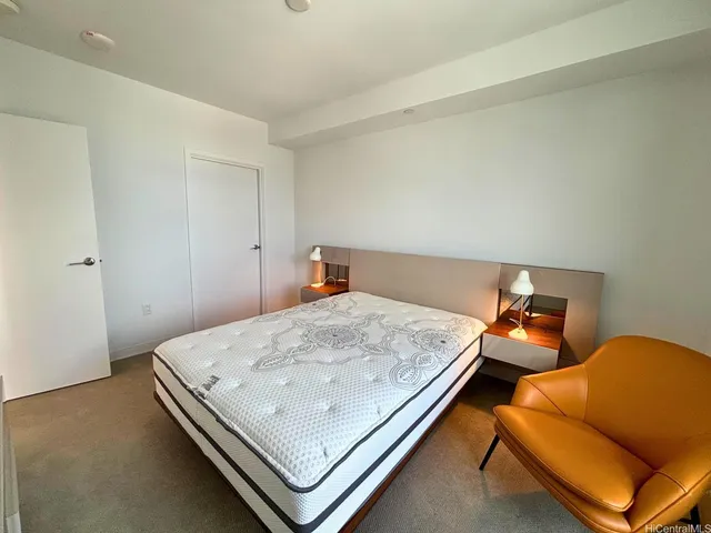 a bedroom with a bed and a couch