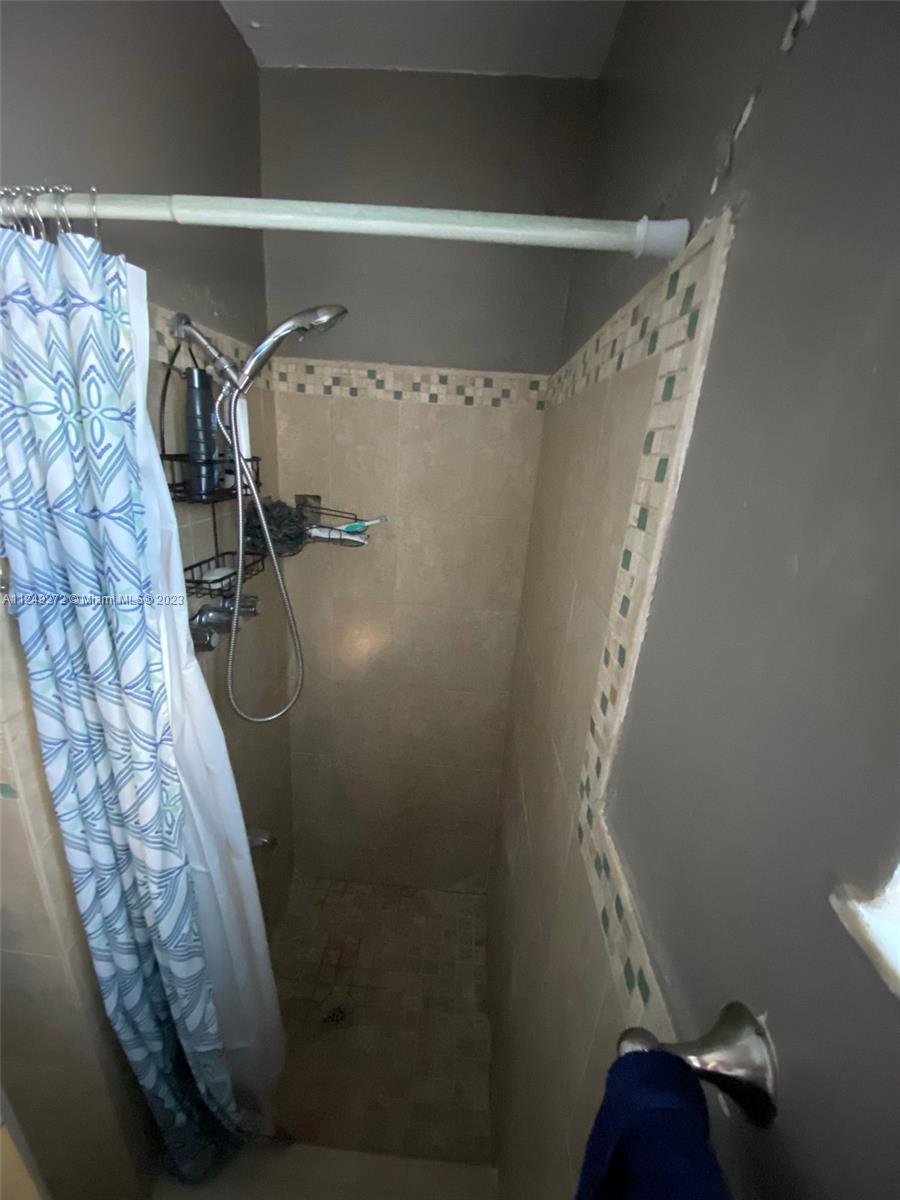 Sunset Miami, FL 33173 - Photo 15 of 18 a bathroom with a shower