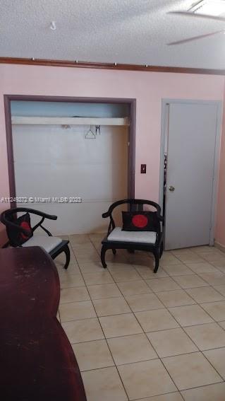 Sunset Miami, FL 33173 - Photo 18 of 18 a room with gym equipment and a table