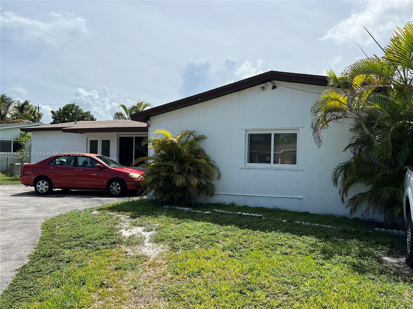 Sunset Miami, FL 33173 - Photo 2 of 18 a front view of a house with garden