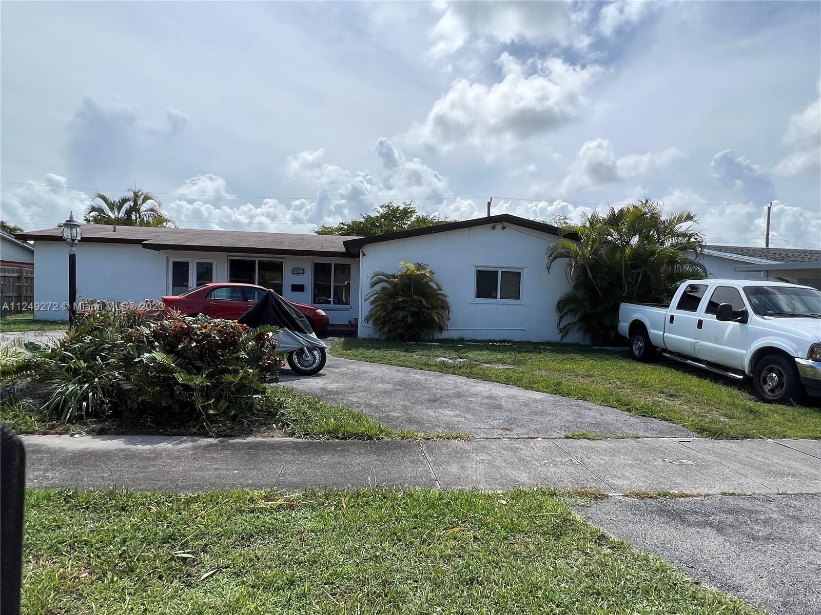 Sunset Miami, FL 33173 - Photo 3 of 18 a front view of a house with garden