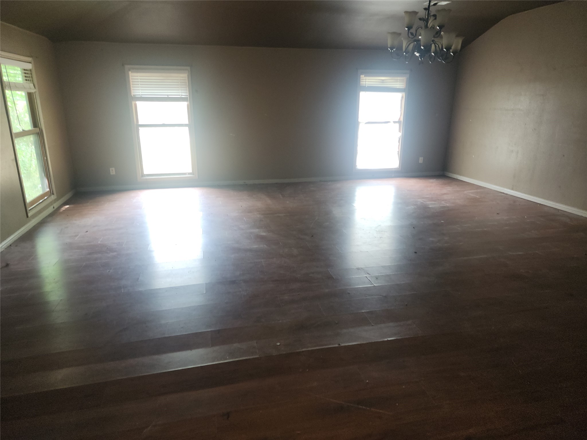 14115 Bohemian Hall Road Crosby, TX 77532 - Photo 19 of 22 an empty room with wooden floor and windows