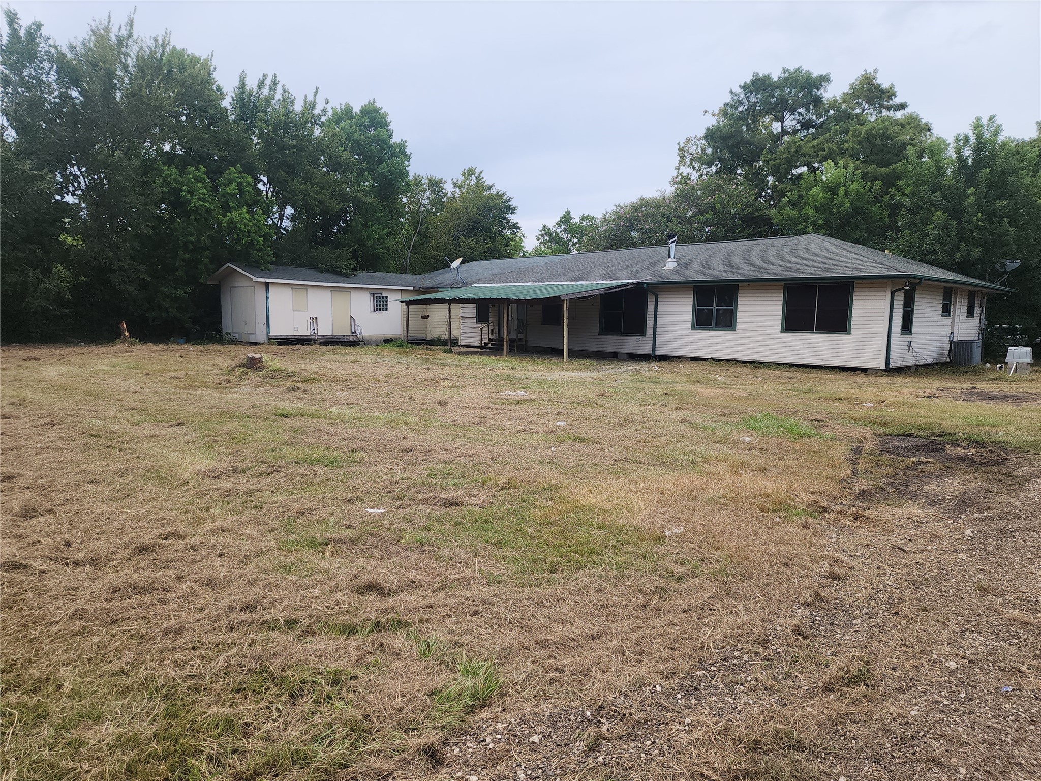 14115 Bohemian Hall Road Crosby, TX 77532 - Photo 22 of 22 a front view of a house with yard and green space