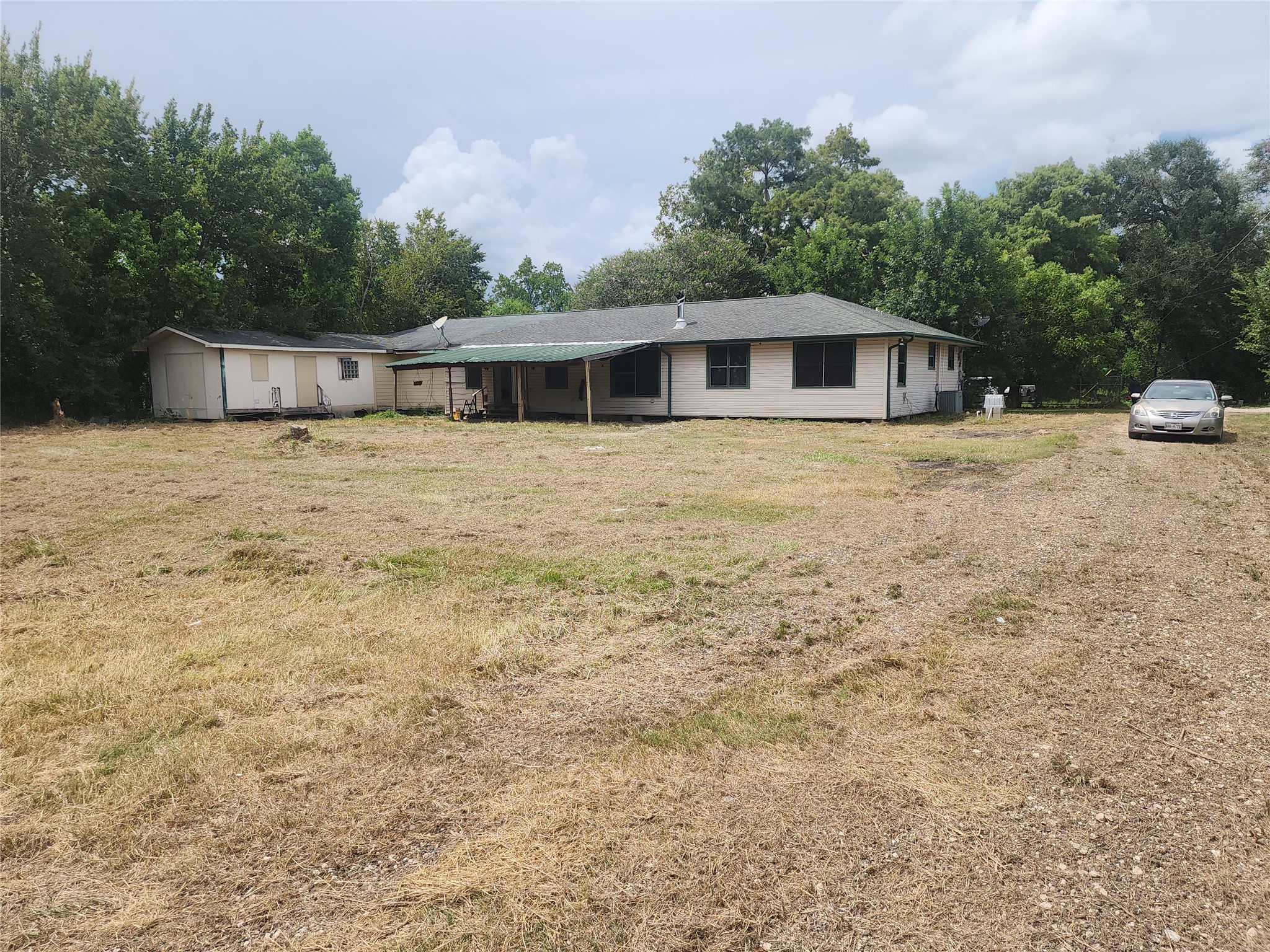 14115 Bohemian Hall Road Crosby, TX 77532 - Photo 4 of 22 a front view of a house with a yard