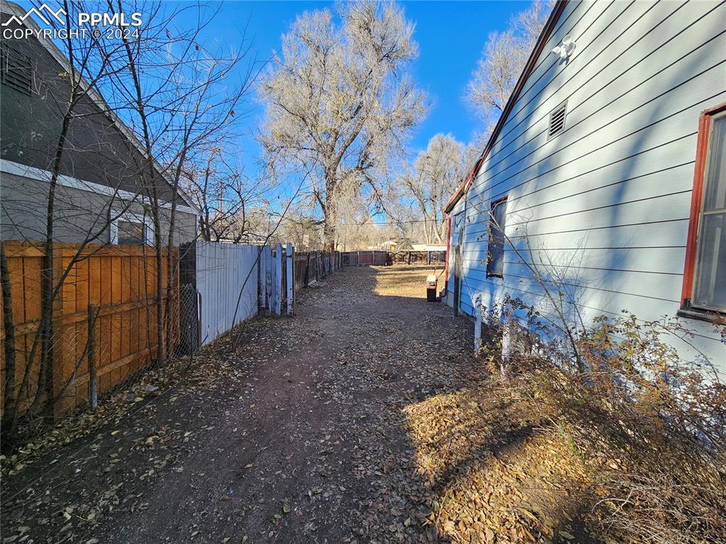 812 Alexander Road Colorado Springs, CO 80909 - Photo 3 of 8 a view of a backyard of the house