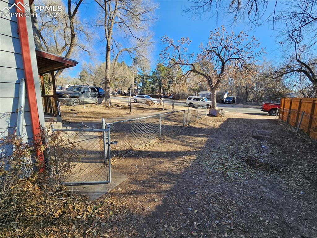 812 Alexander Road Colorado Springs, CO 80909 - Photo 4 of 8 a view of a yard with fountain
