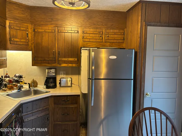 a view of a balcony with furniture and chandelier