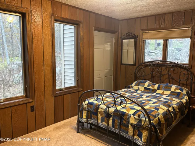 a view of staircase with wooden floor and windows