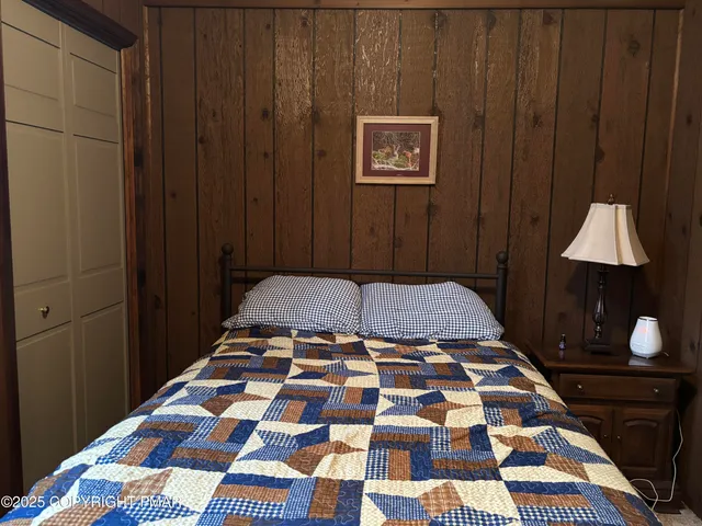 a view of a balcony with wooden floor and fence