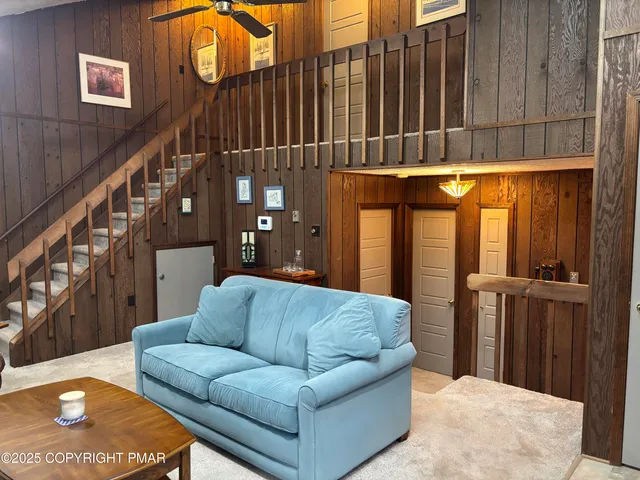 a kitchen with stainless steel appliances granite countertop a dining table and chairs