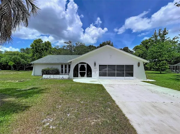 $335,000 | 12302 Deep Creek Drive, Spring Hill, FL 34609