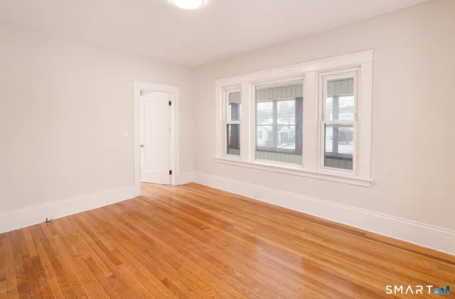 a view of entryway with wooden floor