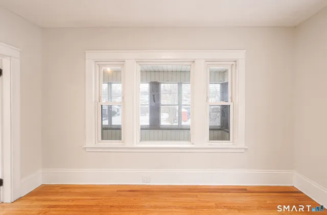 a view of staircase with white walls