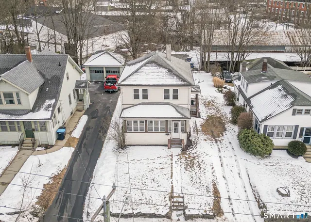 a view of snow on the side of a road