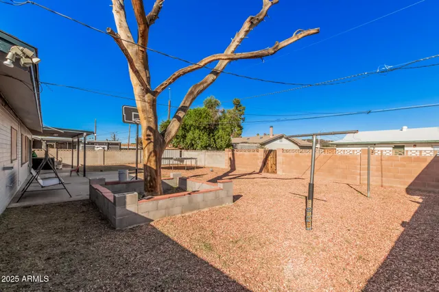 a view of a backyard with a patio