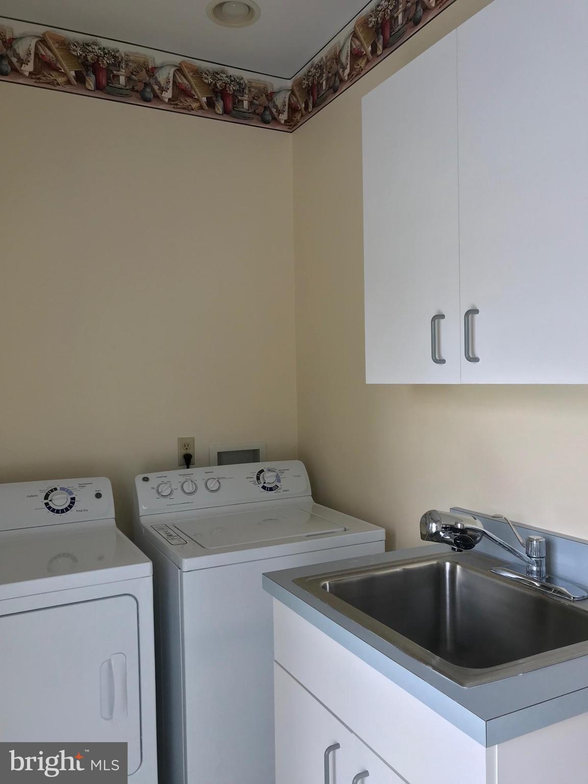 1208 Rodes Circle Winchester, VA 22601 - Photo 22 of 26 Laundry with Sink & Cabinets