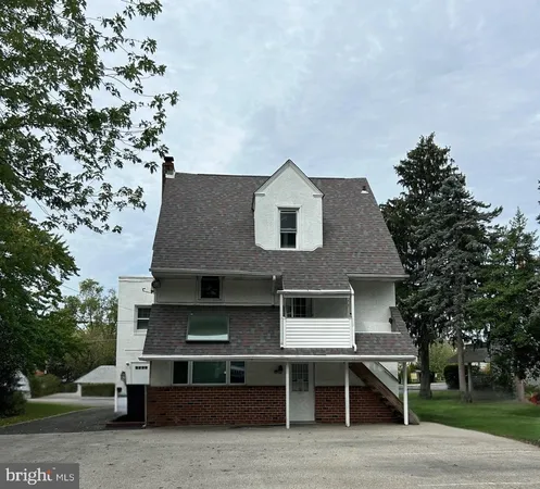 a front view of a house with a porch