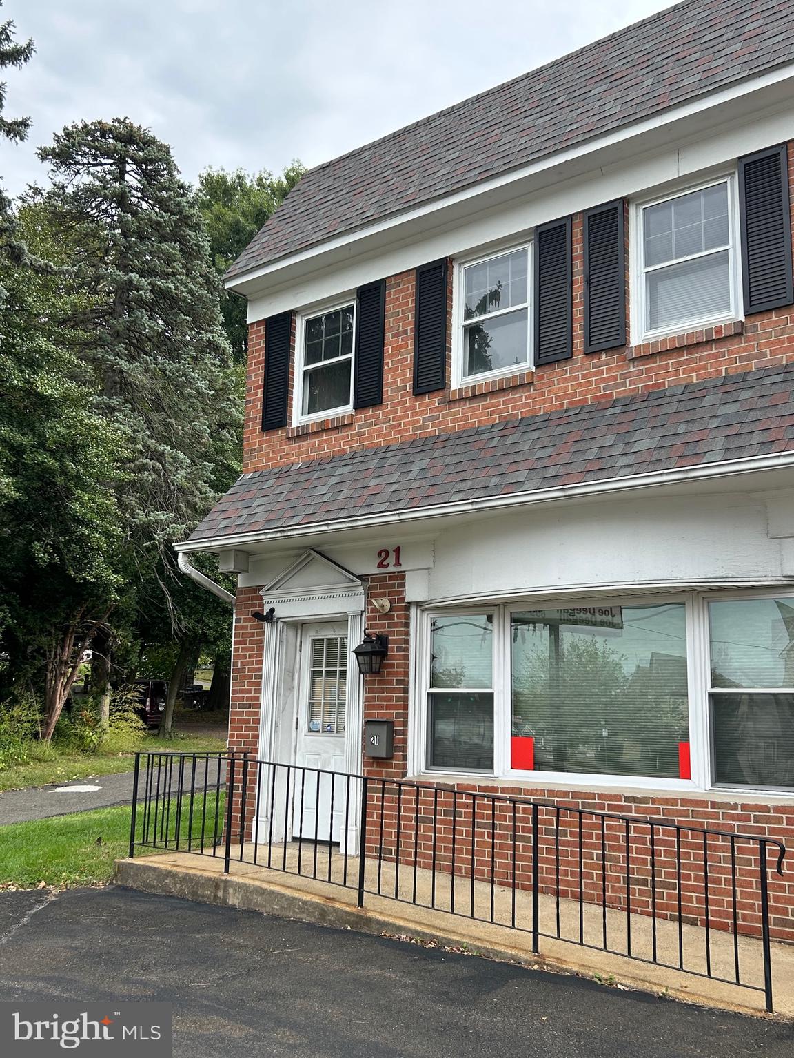 23 North York Road, Unit 21 Willow Grove, PA 19090 - Photo 3 of 18 a front view of a house with a garden