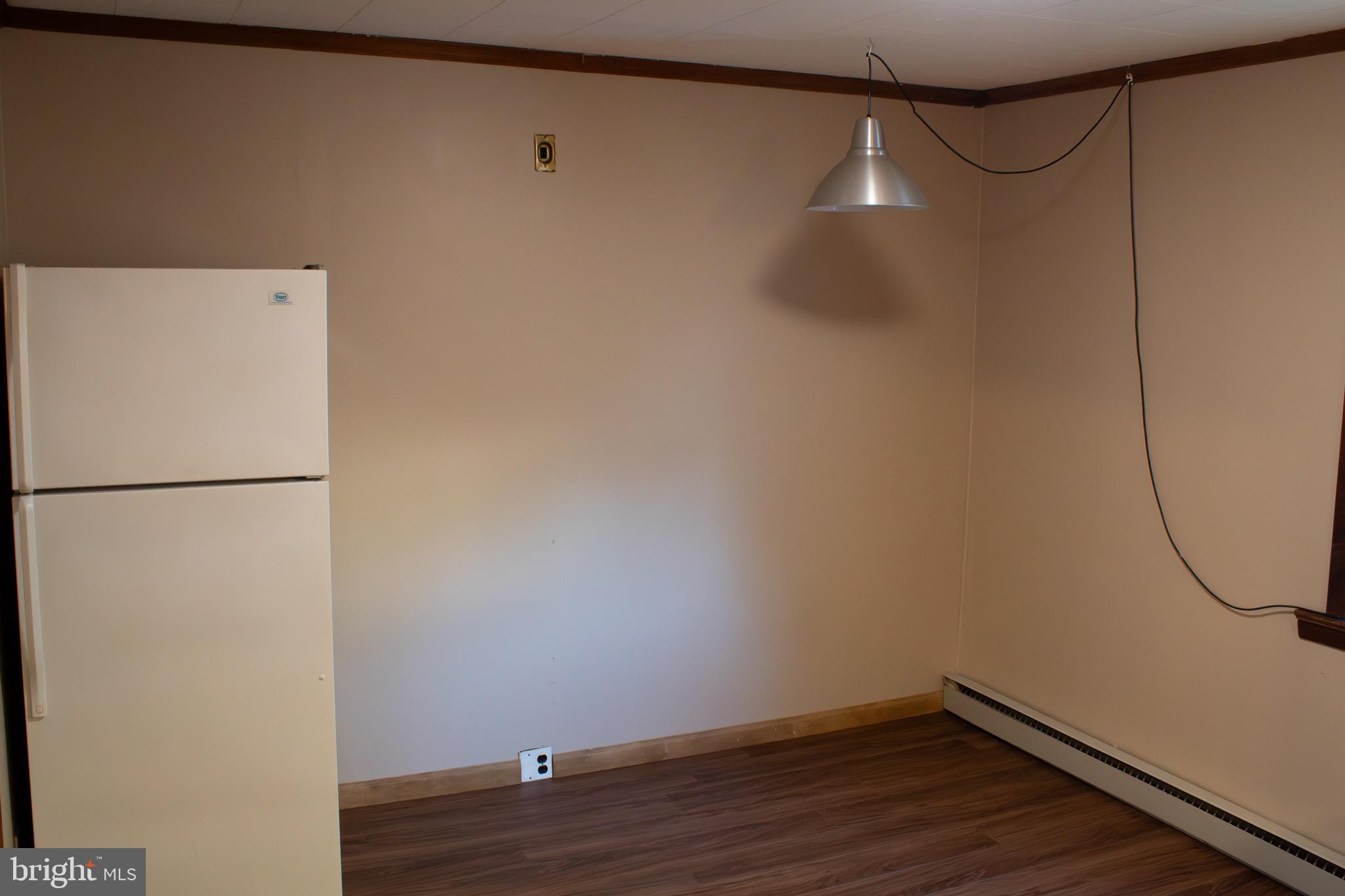 23 North York Road, Unit 21 Willow Grove, PA 19090 - Photo 6 of 18 a room with a dryer and wooden floor