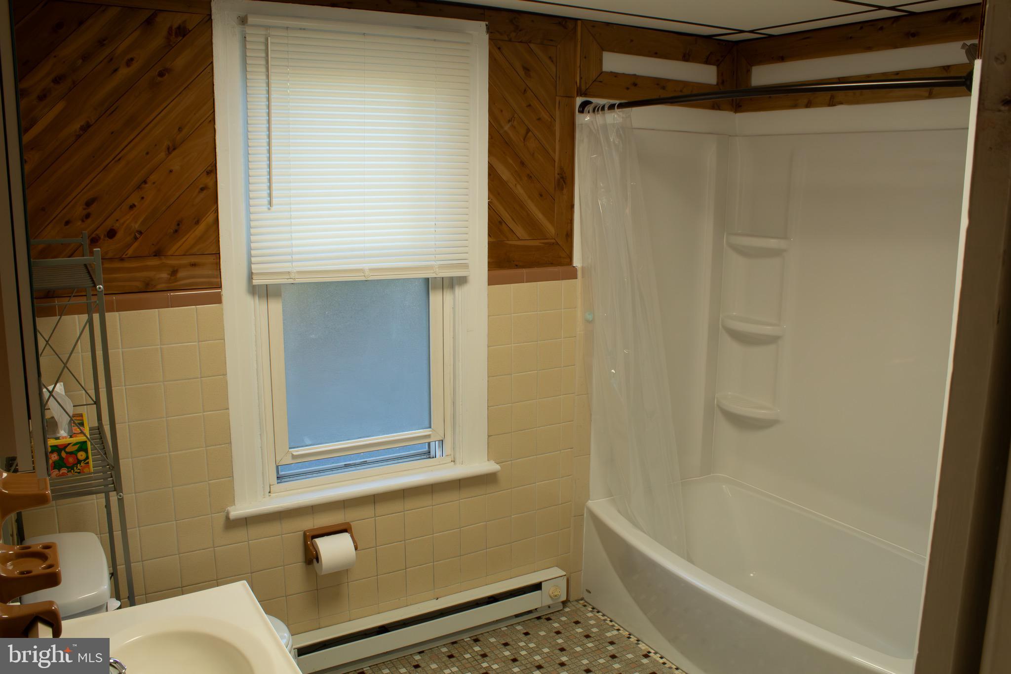 23 North York Road, Unit 21 Willow Grove, PA 19090 - Photo 10 of 18 a bathroom with a shower and a toilet