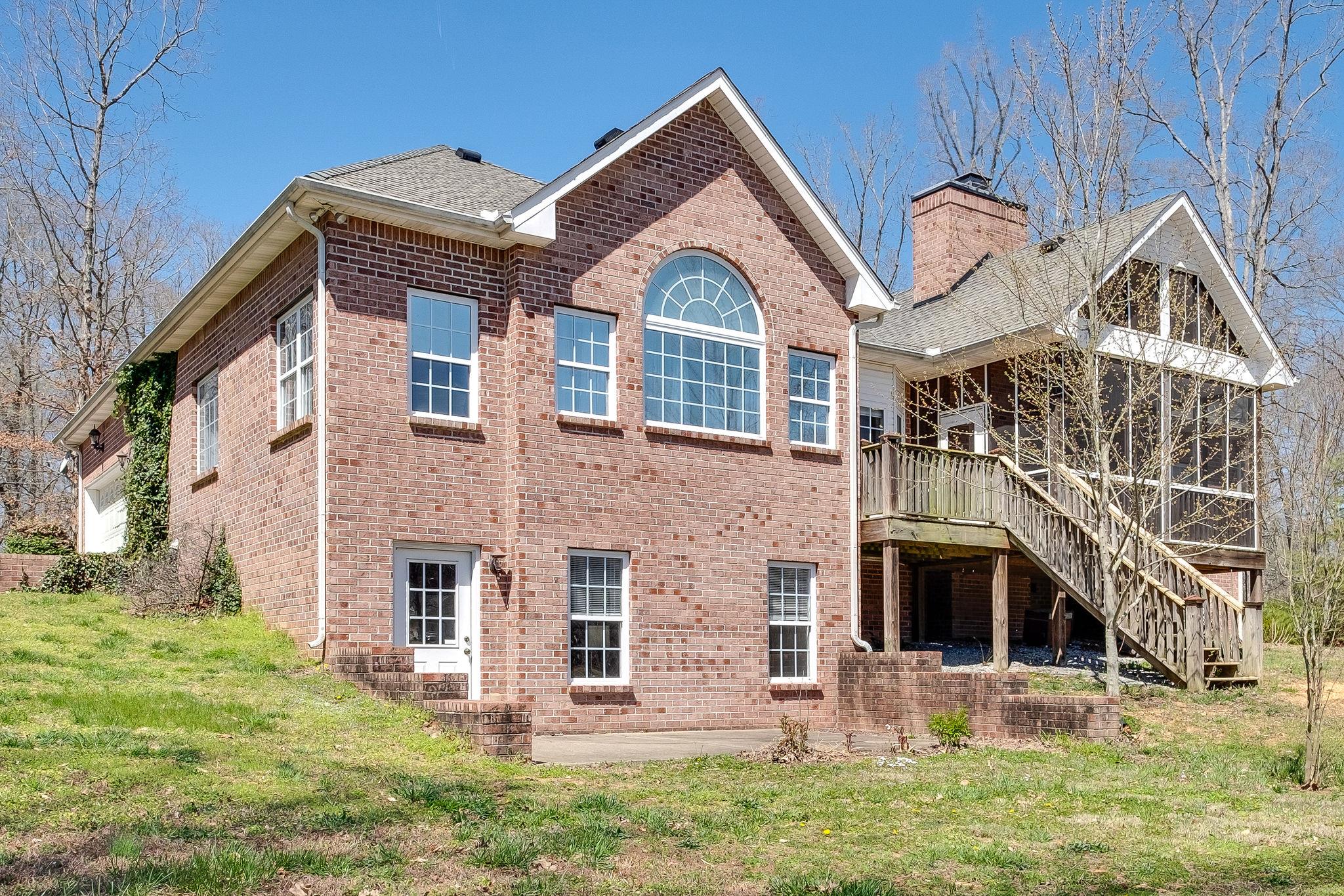 1175 Tidwell Switch Road Dickson, TN 37055 - Photo 14 of 27 a front view of a house with garden